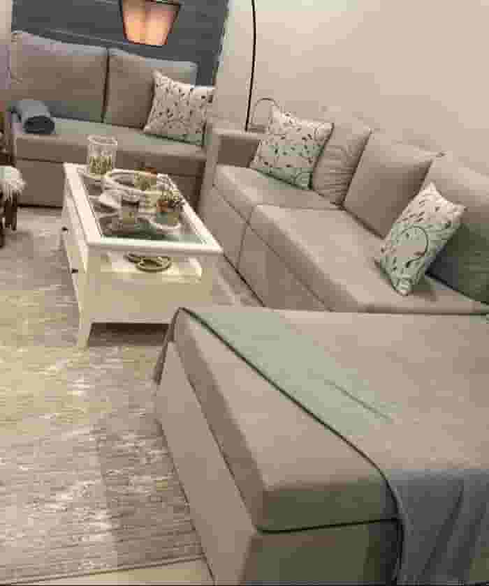 A sparsely used residential sofa set