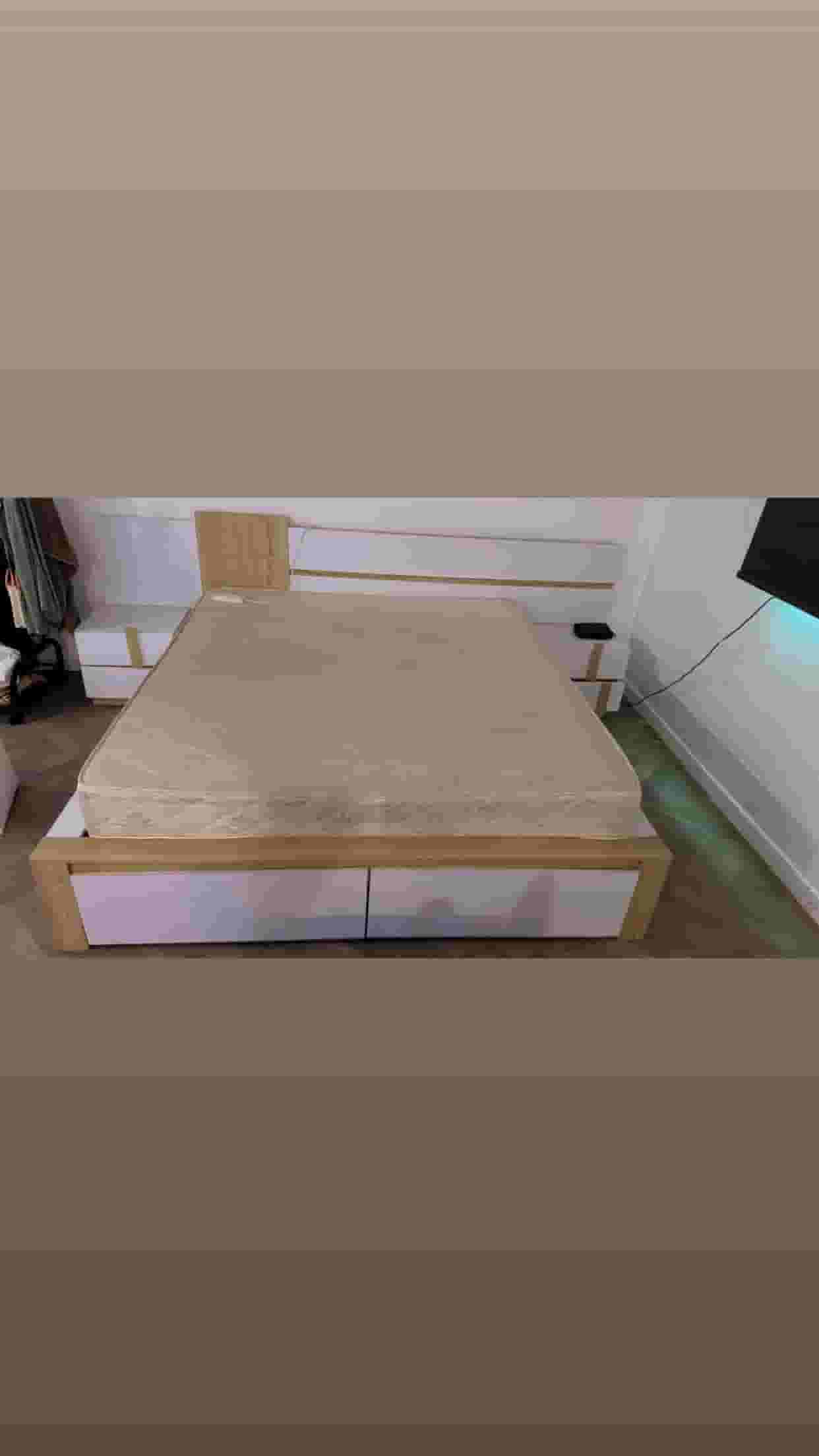 A king bed with large drawers is clean and almost new with a sponge