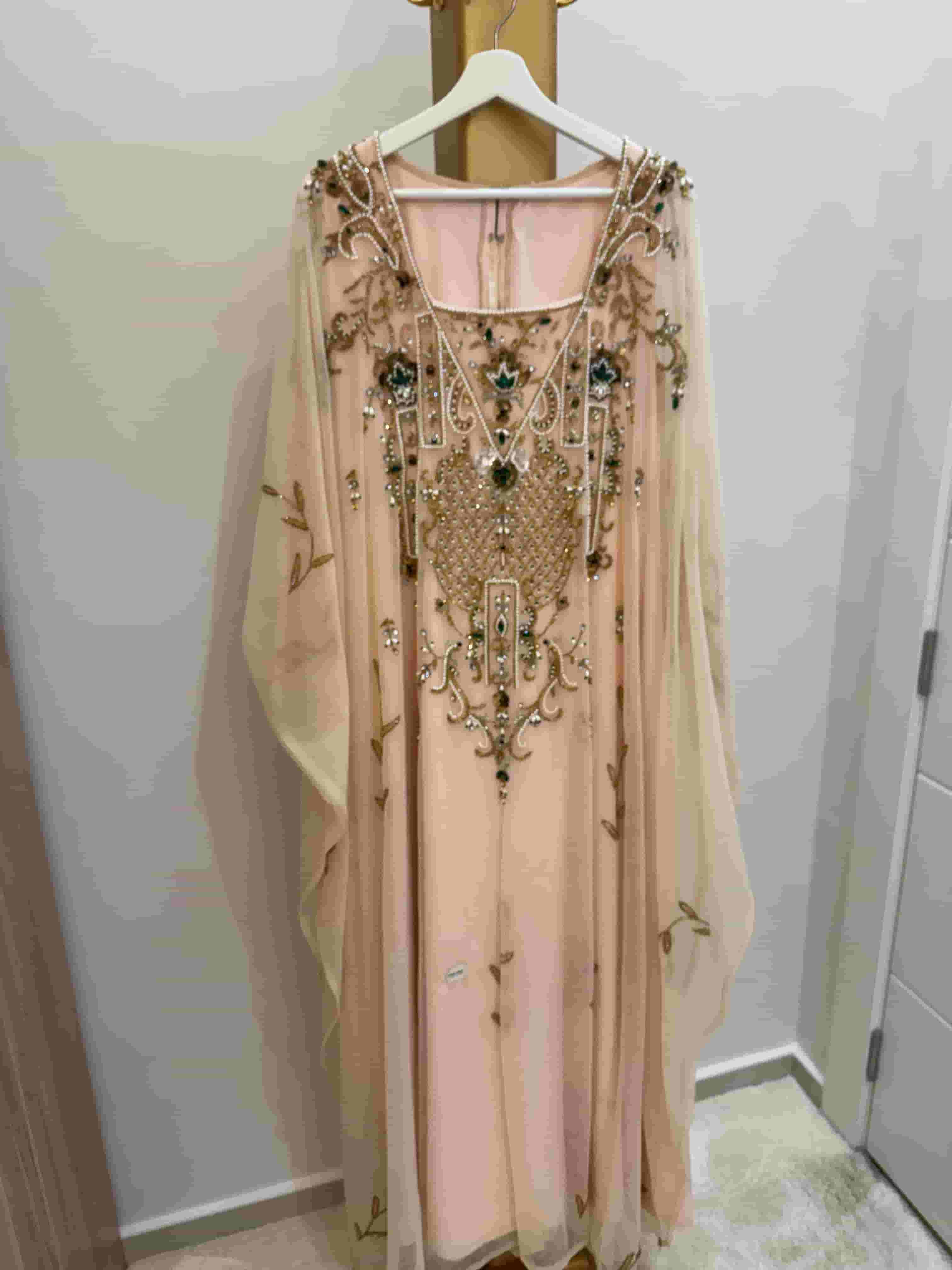 A dress by the designer Ahed Al-Hamad is used lightly 