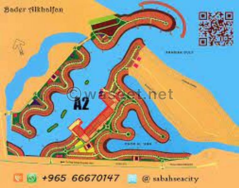 Land for sale in Sabah Al-Ahmad Al-Bahariya, the second phase is 1275 meters, with the belly and back of the waterfront  1