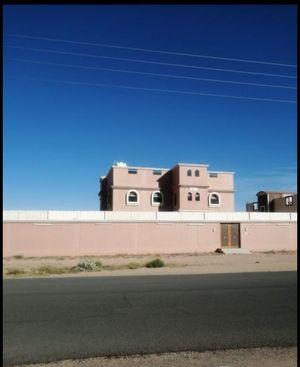 Two-storey building and free land in Saudi Arabia 